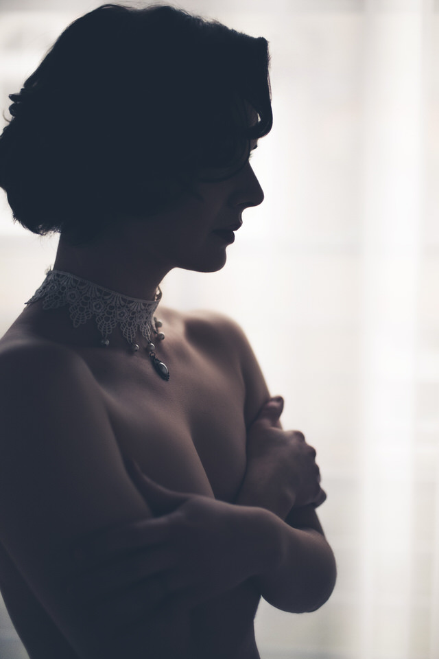 A silhouette of a woman with a bridal neckpiece - wedding decor