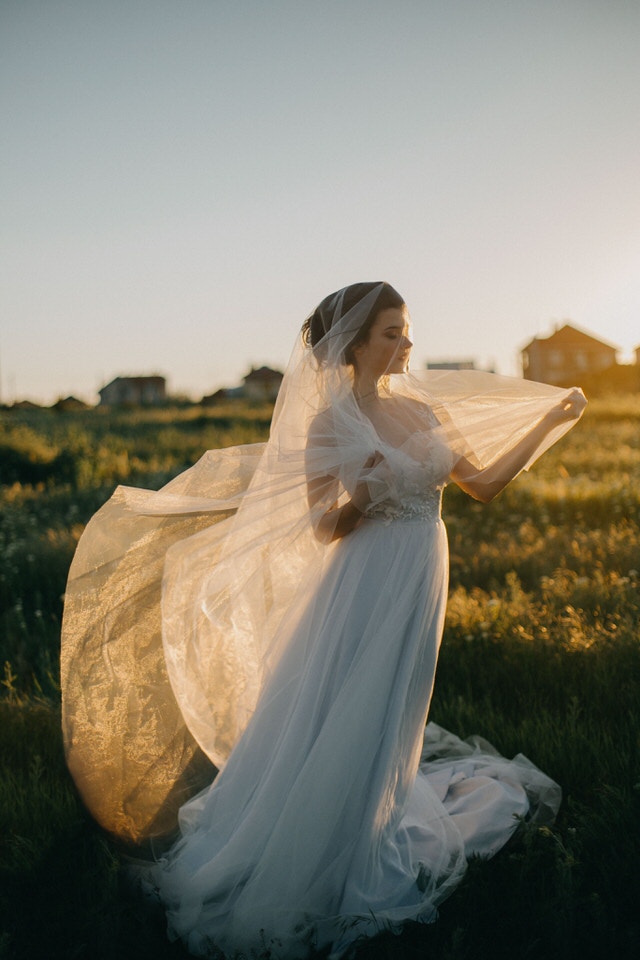 A photo taken at golden hour of a new bride - questions to ask