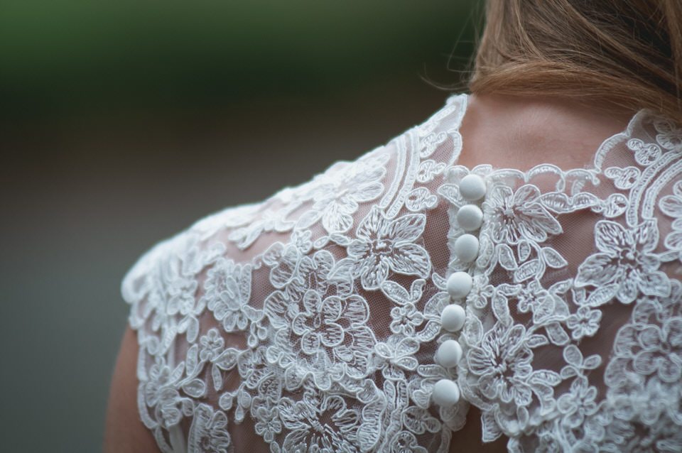 A photo of the lace details on a wedding dress -wedding day