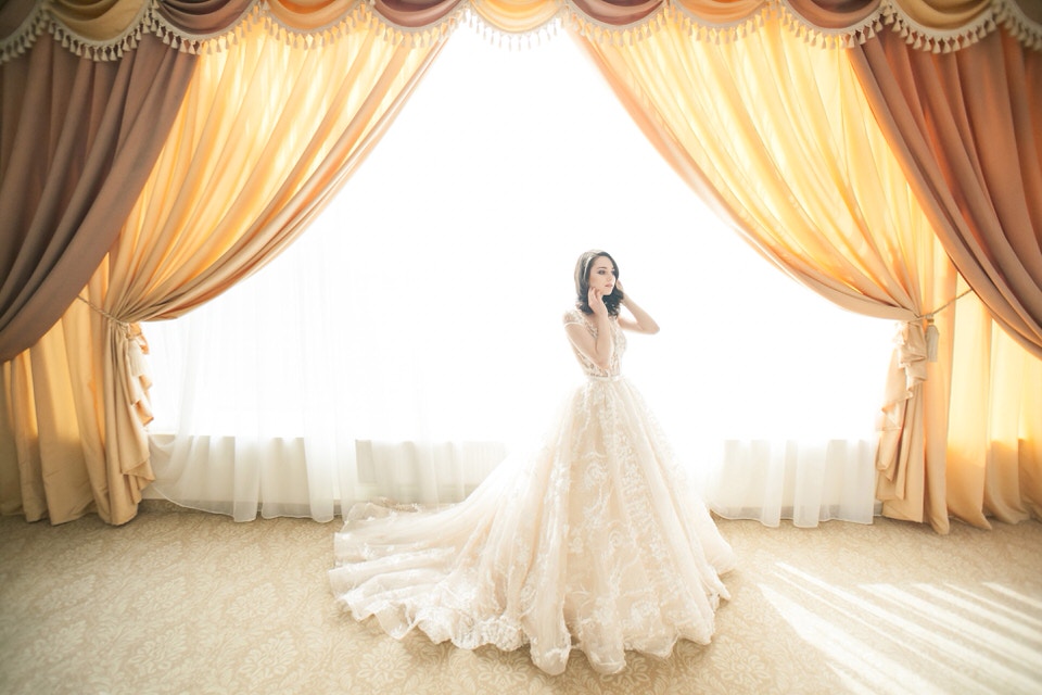 A photo of a new bride in a ballgown dress